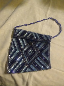 Custom asymmetrical blue beaded bag